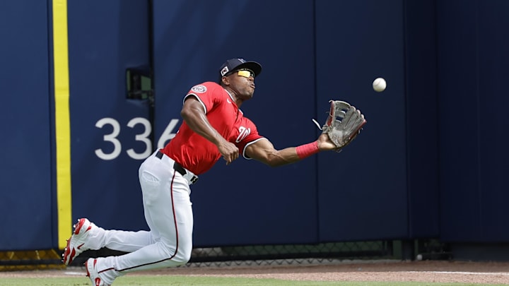 Feb 26, 2025; West Palm Beach, Florida, USA; Washington Nationals outfielder Stone Garrett (36) makes a diving catch during the third inning against the Houston Astros at CACTI Park of the Palm Beaches. Feb 26, 2025; West Palm Beach, Florida, USA; Washington Nationals outfielder Stone Garrett (36) makes a diving catch during the third inning against the Houston Astros at CACTI Park of the Palm Beaches.