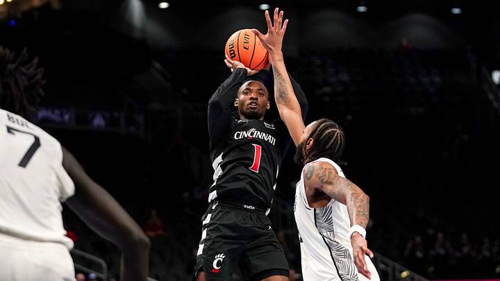 Cincinnati Bearcats guard Day Day Thomas (1) shoots from two point range in the second half of the second round of the Phillips 66 Big 12 Men’s Basketball Tournament between the Cincinnati Bearcats and UCF Knights, Wednesday, March 11, 2026, at T-Mobile Center in Kansas City, MO. Bearcats fall to the Knights 66-65 in overtime. Cincinnati Bearcats guard Day Day Thomas (1) shoots from two point range in the second half of the second round of the Phillips 66 Big 12 Men’s Basketball Tournament between the Cincinnati Bearcats and UCF Knights, Wednesday, March 11, 2026, at T-Mobile Center in Kansas City, MO. Bearcats fall to the Knights 66-65 in overtime.