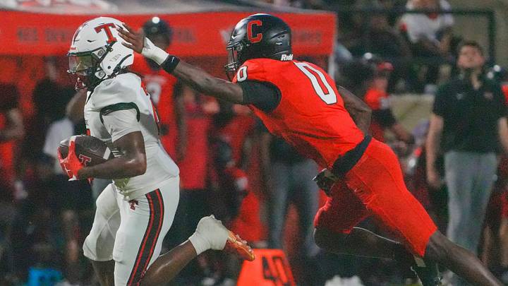 Central-Phenix City's Jermaine King (0) chases Thompson's Mason McClure (2) during the AHSAA Football Kickoff Classic Game in Phenix City, Ala., on Thursday August 20, 2026. Central-Phenix City's Jermaine King (0) chases Thompson's Mason McClure (2) during the AHSAA Football Kickoff Classic Game in Phenix City, Ala., on Thursday August 20, 2026.