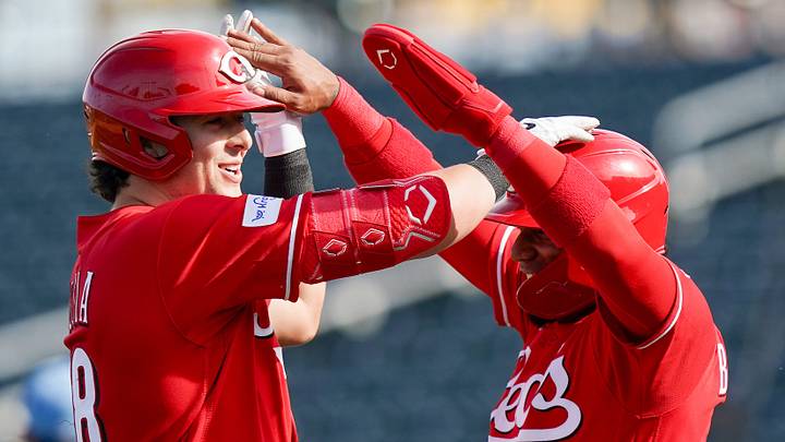Cincinnati Reds first baseman Michael Toglia (48) and infielder Leo Balcazar (85) celebrate a 5-4 win against the Kansas City Royals, Tuesday, Feb. 24, 2026, at Goodyear Ballpark in Goodyear, Ariz. Cincinnati Reds first baseman Michael Toglia (48) and infielder Leo Balcazar (85) celebrate a 5-4 win against the Kansas City Royals, Tuesday, Feb. 24, 2026, at Goodyear Ballpark in Goodyear, Ariz.