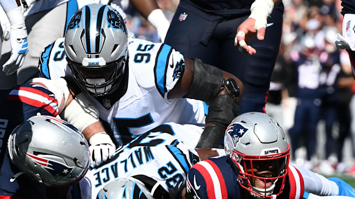 New England Patriots running back Treveyon Henderson (32) scores a touchdown against the Carolina Panthers during the first half at Gillette Stadium.