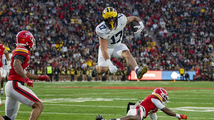 Michigan Wolverines tight end Marlin Klein (17) leaps Maryland Terrapins defensive back Jamare Glasker