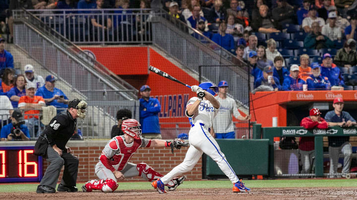 Gators infielder Colby Shelton (10) makes his debut in Orange and Blue in Game 1 against St. John  s