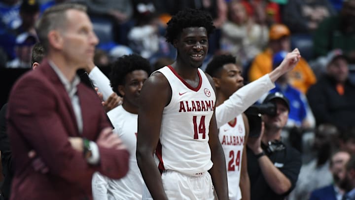 Mar 10, 2023; Nashville, TN, USA; Alabama Crimson Tide center Charles Bediako (14) and teammates celebrate on the bench in the closing seconds of a win against the Mississippi State Bulldogs at Bridgestone Arena. 