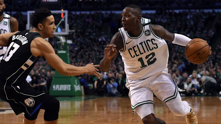 Apr 17, 2018; Boston, MA, USA; Boston Celtics guard Terry Rozier (12) controls the ball while Milwaukee Bucks guard Malcolm Brogdon (13) defends during the second half in game two of the first round of the 2018 NBA Playoffs at TD Garden. Mandatory Credit: Bob DeChiara-Imagn Images