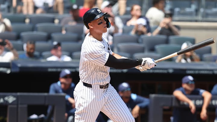 May 3, 2025; Bronx, New York, USA; New York Yankees right fielder Aaron Judge (99) hits a solo home run in the first inning against the Tampa Bay Rays at Yankee Stadium. May 3, 2025; Bronx, New York, USA; New York Yankees right fielder Aaron Judge (99) hits a solo home run in the first inning against the Tampa Bay Rays at Yankee Stadium.