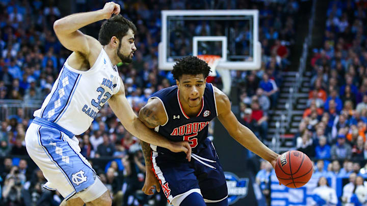 Mar 29, 2019; Kansas City, MO, United States; Auburn Tigers forward Chuma Okeke (5) dribbles the ball against North Carolina Tar Heels forward Luke Maye (32) in the semifinals of the midwest regional of the 2019 NCAA Tournament at Sprint Center. Mandatory Credit: Jay Biggerstaff-Imagn Images