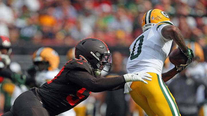 Cleveland Browns defensive end Isaiah McGuire (57) dives for Green Bay Packers wide receiver Matthew Golden (0) during the second half of an NFL football game at Huntington Bank Field, Sept. 21, 2025, in Cleveland, Ohio.