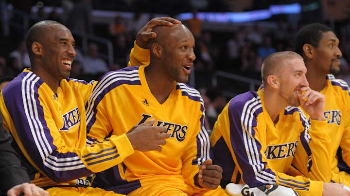 Nov 2, 2010; Los Angeles, CA, USA; Los Angeles Lakers players (from left) Kobe Bryant, Lamar Odom, Steve Blake, and Ron Artest watch on the bench in the fourth quarter against the Memphis Grizzlies at the Staples Center. The Lakers defeated the Grizzlies 124-105. Mandatory Credit: Kirby Lee/Image of Sport-Imagn Images