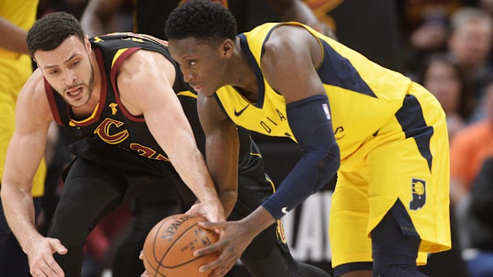 Apr 29, 2018; Cleveland, OH, USA; Cleveland Cavaliers forward Larry Nance Jr. (22) and Indiana Pacers guard Victor Oladipo (4) go for a loose ball during the second half in game seven of the first round of the 2018 NBA Playoffs at Quicken Loans Arena. Mandatory Credit: Ken Blaze-Imagn Images