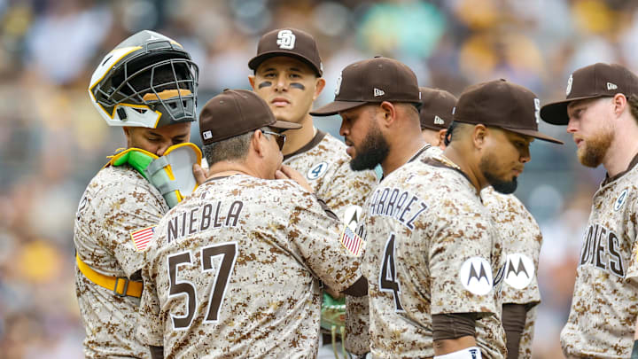 Jun 1, 2025; San Diego, California, USA; San Diego Padres Pitching Coach Ruben Niebla (57) speaks with starting pitcher Randy Vasquez (98) during the third inning against the Pittsburgh Pirates at Petco Park. Mandatory Credit: David Frerker-Imagn Images