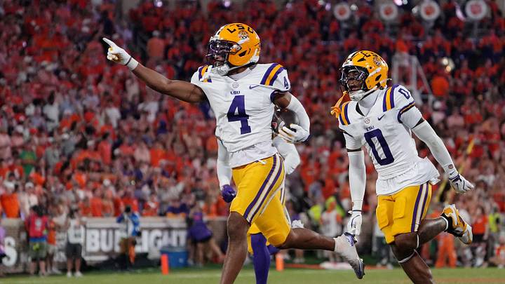 Aug 30, 2025; Clemson, South Carolina, USA; LSU Tigers cornerback Mansoor Delane (4) celebrates with safety Tamarcus Cooley (0) after a play against the Clemson Tigers during the second half at Memorial Stadium. Mandatory Credit: Ken Ruinard-USA TODAY Network via Imagn Images