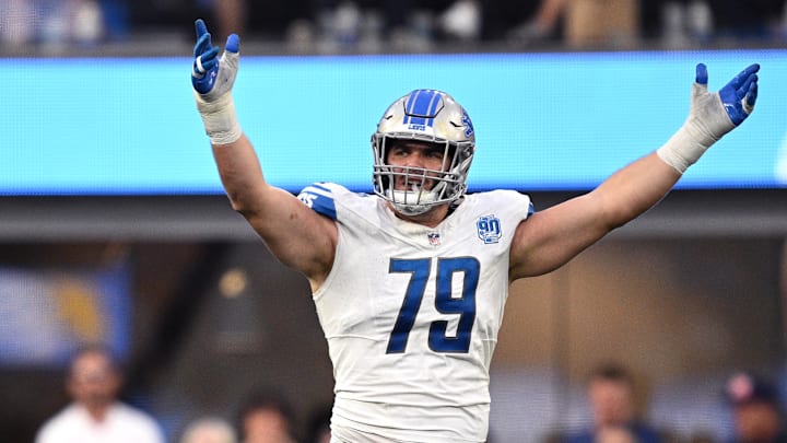 Detroit Lions defensive end John Cominsky (79).