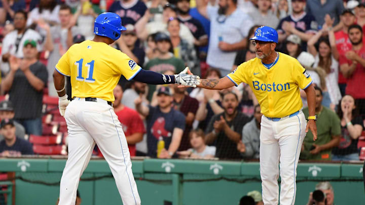 May 3, 2025; Boston, Massachusetts, USA; Boston Red Sox designated hitter Rafael Devers (11) is congratulated by first base coach/infield instructor José David Flores (58) after hitting an RBI single during the seventh inning against the Minnesota Twins at Fenway Park. Mandatory Credit: Bob DeChiara-Imagn Images May 3, 2025; Boston, Massachusetts, USA; Boston Red Sox designated hitter Rafael Devers (11) is congratulated by first base coach/infield instructor José David Flores (58) after hitting an RBI single during the seventh inning against the Minnesota Twins at Fenway Park. Mandatory Credit: Bob DeChiara-Imagn Images