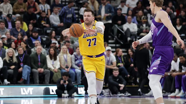 Feb 12, 2025; Salt Lake City, Utah, USA;  Los Angeles Lakers guard Luka Doncic (77) passes during the first quarter against the Utah Jazz at Delta Center. Mandatory Credit: Chris Nicoll-Imagn Images