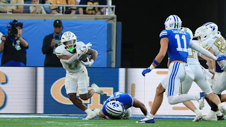 Dec 27, 2025; Orlando, FL, USA; Georgia Tech Yellow Jackets running back Malachi Hosley (0)  runs with the ball against the BYU Cougars  during the first half at Camping World Stadium. Mandatory Credit: Kim Klement Neitzel-Imagn Images