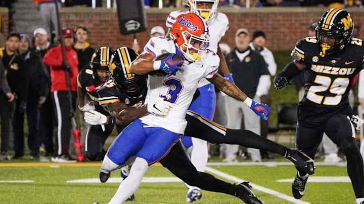Nov 18, 2023; Columbia, Missouri, USA; Florida Gators wide receiver Eugene Wilson III (3) returns a kickoff as Missouri Tigers cornerback Ja'Marion Wayne (25) makes the tackle during the second half at Faurot Field at Memorial Stadium. Mandatory Credit: Denny Medley-Imagn Images Nov 18, 2023; Columbia, Missouri, USA; Florida Gators wide receiver Eugene Wilson III (3) returns a kickoff as Missouri Tigers cornerback Ja'Marion Wayne (25) makes the tackle during the second half at Faurot Field at Memorial Stadium. Mandatory Credit: Denny Medley-Imagn Images