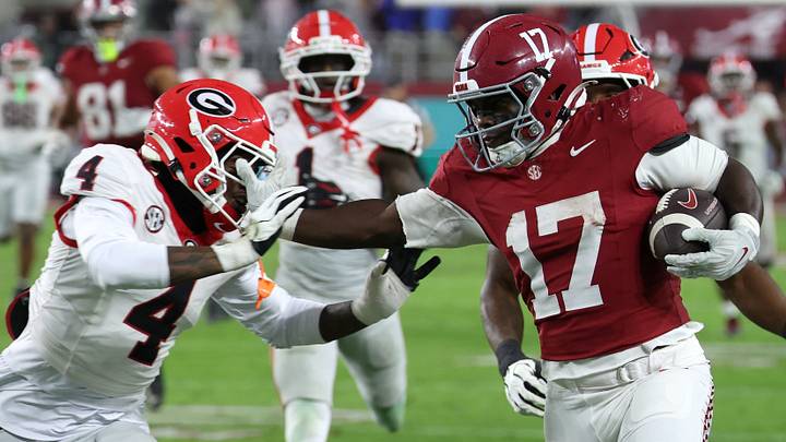 Oct 10, 2026; Tuscaloosa, Alabama, USA;  Alabama Crimson Tide running back Trae'shawn Brown (17) carries the ball defended by Georgia Bulldogs defensive back KJ Bolden (4) during the second quarter at Saban Field at Bryant-Denny Stadium.  Mandatory Credit: David Leong-Imagn Images