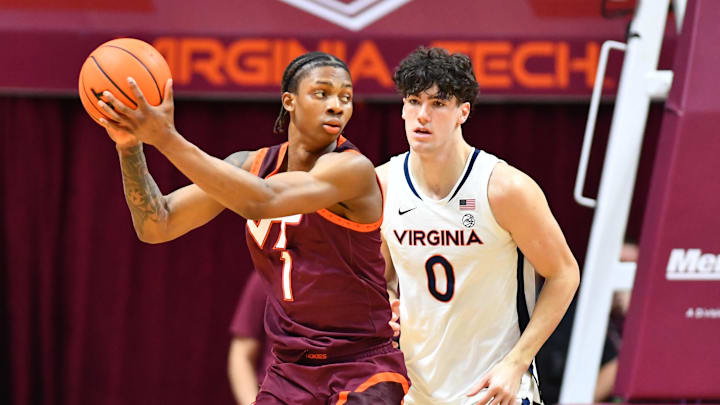 Feb 15, 2025; Blacksburg, Va.; Virginia Tech forward Tobi Lawal (1) works against Virginia forward Blake Buchanan (0).