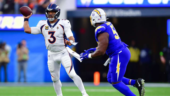 Dec 10, 2023; Inglewood, California, USA; Denver Broncos quarterback Russell Wilson (3) throws under pressure from Los Angeles Chargers defensive tackle Sebastian Joseph-Day (51) during the second half at SoFi Stadium. Mandatory Credit: Gary A. Vasquez-USA TODAY Sports