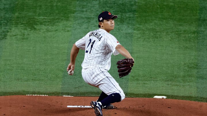 Mar 21, 2023; Miami, Florida, USA; Japan starting pitcher Shota Imanaga (21) pitches against the USA