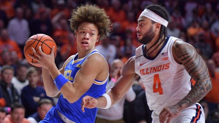 Feb 11, 2025; Champaign, Illinois, USA; UCLA Bruins guard Trent Perry (1) drives the ball against Illinois Fighting Illini guard Kylan Boswell (4) during the second half at State Farm Center. Mandatory Credit: Ron Johnson-Imagn Images Feb 11, 2025; Champaign, Illinois, USA; UCLA Bruins guard Trent Perry (1) drives the ball against Illinois Fighting Illini guard Kylan Boswell (4) during the second half at State Farm Center. Mandatory Credit: Ron Johnson-Imagn Images
