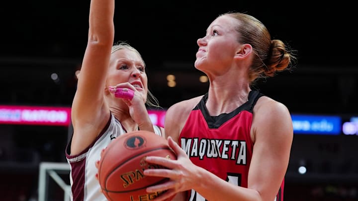 Maquoketa Cora Widel (44) shoots the ball over around Mount Vernon guard Alivia Truitt (3) during the second quarter in the 3A girls high school state basketball championship game on March 6, 2026, at Casey’s Center in Des Moines, Iowa.