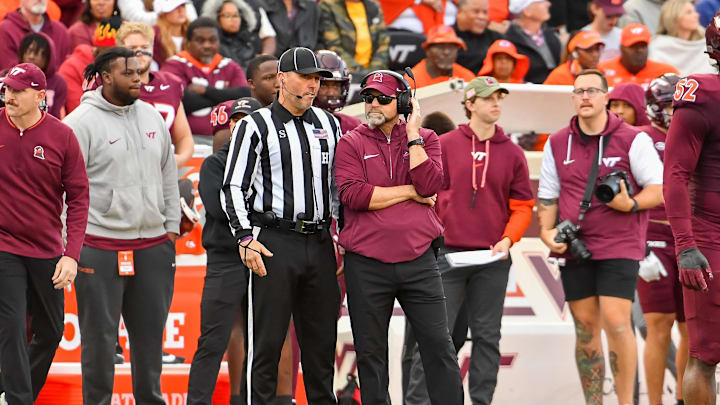 Nov 9, 2024; Blacksburg, Virginia, USA;  Virginia Tech Hokies head coach Brent Pry talks to an official during the second quarter against the Clemson Tigers at Lane Stadium. Mandatory Credit: Brian Bishop-Imagn Images