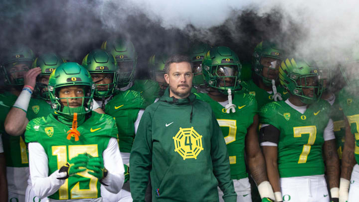 Oregon head coach Dan Lanning, center, waits to take the field with his team for their game against Oregon State at Autzen Stadium Friday, Nov. 24, 2023.