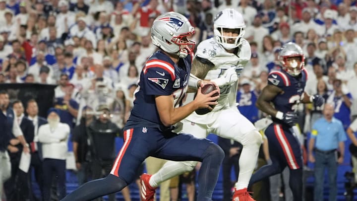 Oct 5, 2025; Orchard Park, New York, USA; New England Patriots quarterback Drake Maye (10) rushes the ball against the Buffalo Bills during the first half at Highmark Stadium. Mandatory Credit: Gregory Fisher-Imagn Images