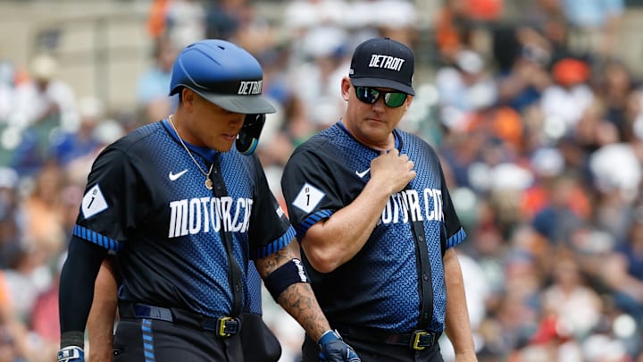 May 26, 2024; Detroit, Michigan, USA; Detroit Tigers manager AJ Hinch checks with Detroit Tigers third baseman Gio Urshela (13) after he was hit by a pitch in the eighth inning of the game against the Toronto Blue Jays at Comerica Park. 
