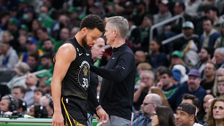 Golden State Warriors guard Stephen Curry (30) heads to the bench past head coach Steve Kerr as they take on the Boston Celtics in the second half at TD Garden. Mandatory Credit: David Butler II-Imagn Images