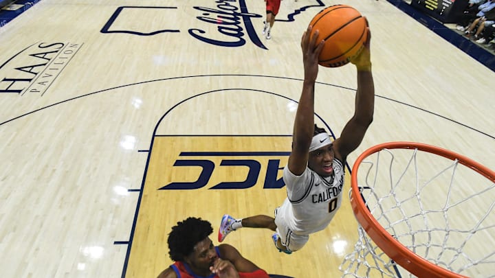 Feb 26, 2025; Berkeley, California, USA; California Golden Bears guard Jeremiah Wilkinson (0) dunks against SMU Mustangs guard Kario Oquendo (8) in the first half at Haas Pavilion. Mandatory Credit: Eakin Howard-Imagn Images Feb 26, 2025; Berkeley, California, USA; California Golden Bears guard Jeremiah Wilkinson (0) dunks against SMU Mustangs guard Kario Oquendo (8) in the first half at Haas Pavilion. Mandatory Credit: Eakin Howard-Imagn Images