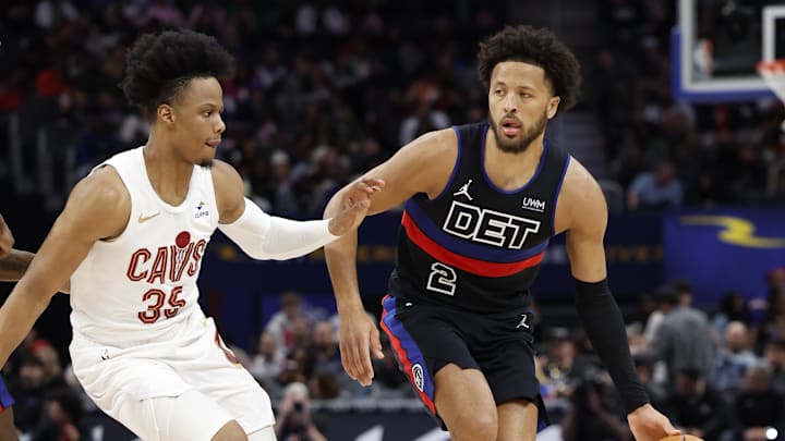 Mar 1, 2024; Detroit, Michigan, USA;  Detroit Pistons guard Cade Cunningham (2) dribbles defended by Cleveland Cavaliers forward Isaac Okoro (35) in the first half at Little Caesars Arena. Mandatory Credit: Rick Osentoski-Imagn Images
