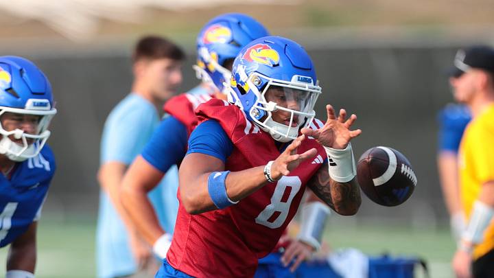 Kansas redshirt sophomore quarterback Isaiah Marshall (8) works on a drill during fall camp practice on Aug. 4, 2026.