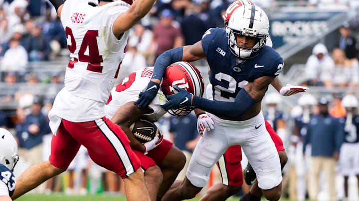 Penn State's Kevin Winston Jr. (21) tackles Indiana's Jaylin Lucas during a kickoff return in the second half of an NCAA football game at Beaver Stadium Saturday, Oct. 28, 2023, in State College, Pa. The Nittany Lions won, 33-24.