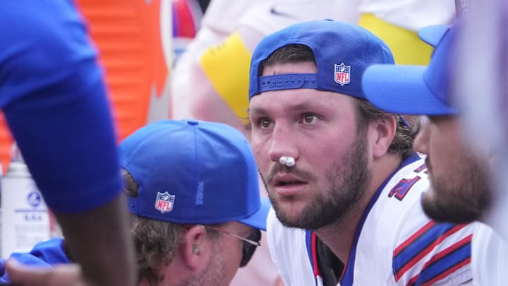 Bills quarterback Josh Allen (17) is tended to by medical staff on the bench vs. the Jets