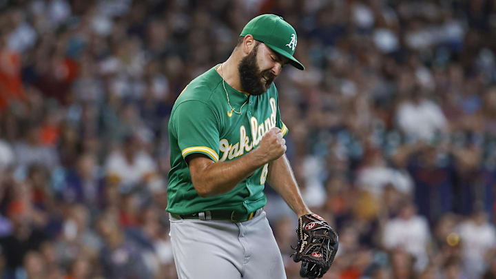Jul 17, 2022; Houston, Texas, USA; Oakland Athletics relief pitcher Lou Trivino (62) reacts after the final out during the ninth inning against the Houston Astros at Minute Maid Park. Mandatory Credit: Troy Taormina-Imagn Images