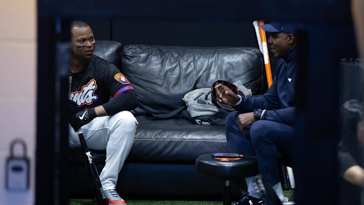 Jun 17, 2025; San Francisco, California, USA; Newly acquired San Francisco Giants designated hitter Rafael Devers (16) chats with former Giants star Barry Bonds before his first game with his new team against the Cleveland Guardians at Oracle Park. Mandatory Credit: D. Ross Cameron-Imagn Images