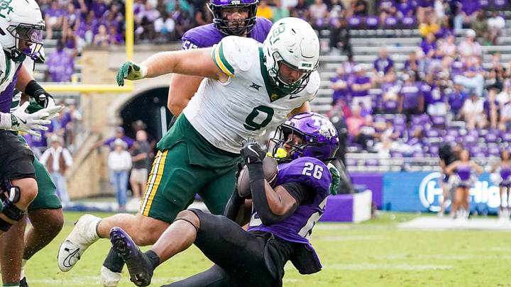 Oct 18, 2025; Fort Worth, Texas, USA; TCU Horned Frogs running back Jeremy Payne (26) is thrown down by Baylor Bears defensive lineman Cooper Lanz (9) Oct 18, 2025; Fort Worth, Texas, USA; TCU Horned Frogs running back Jeremy Payne (26) is thrown down by Baylor Bears defensive lineman Cooper Lanz (9)