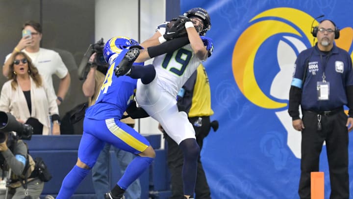 Jan 5, 2025; Inglewood, California, USA; Seattle Seahawks wide receiver Jake Bobo (19) hangs on to the ball in the end zone for a touchdown as he is defended by Los Angeles Rams cornerback Cobie Durant (14) in the first half at SoFi Stadium. Mandatory Credit: Jayne Kamin-Oncea-Imagn Images Jan 5, 2025; Inglewood, California, USA; Seattle Seahawks wide receiver Jake Bobo (19) hangs on to the ball in the end zone for a touchdown as he is defended by Los Angeles Rams cornerback Cobie Durant (14) in the first half at SoFi Stadium. Mandatory Credit: Jayne Kamin-Oncea-Imagn Images