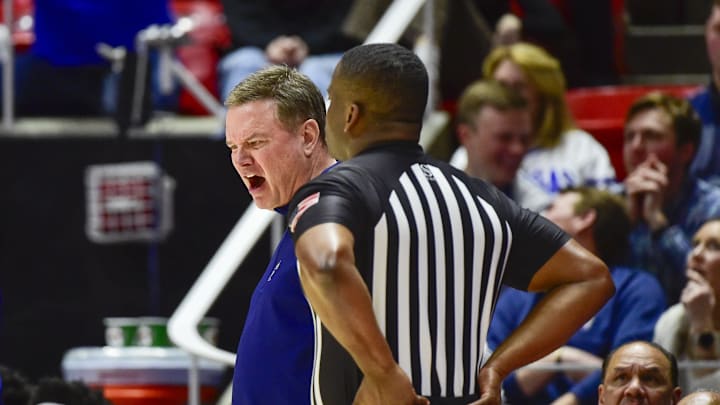 Feb 15, 2025; Salt Lake City, Utah, USA; Kansas Jayhawks head coach Bill Self argues with a referee after a call against the Utah Utes during the first half at the Jon M. Huntsman Center. Mandatory Credit: Christopher Creveling-Imagn Images