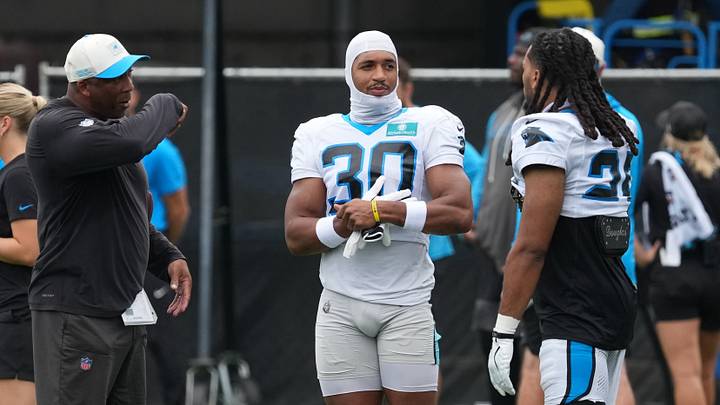 Backs coach Bernie Parmalee talks with running back Chuba Hubbard (30), running back Jonathon Brooks (25) during training camp at Bank of America Stadium. Mandatory Credit: Jim Dedmon-Imagn Images Backs coach Bernie Parmalee talks with running back Chuba Hubbard (30), running back Jonathon Brooks (25) during training camp at Bank of America Stadium. Mandatory Credit: Jim Dedmon-Imagn Images