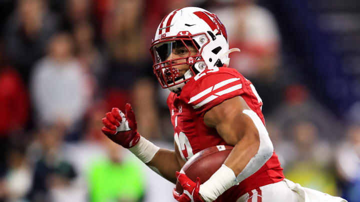 Dec 7, 2019; Indianapolis, IN, USA; Wisconsin Badgers running back Jonathan Taylor (23) carries the ball for a touchdown against the Ohio State Buckeyes during the first half in the 2019 Big Ten Championship Game at Lucas Oil Stadium. Mandatory Credit: Aaron Doster-USA TODAY Sports