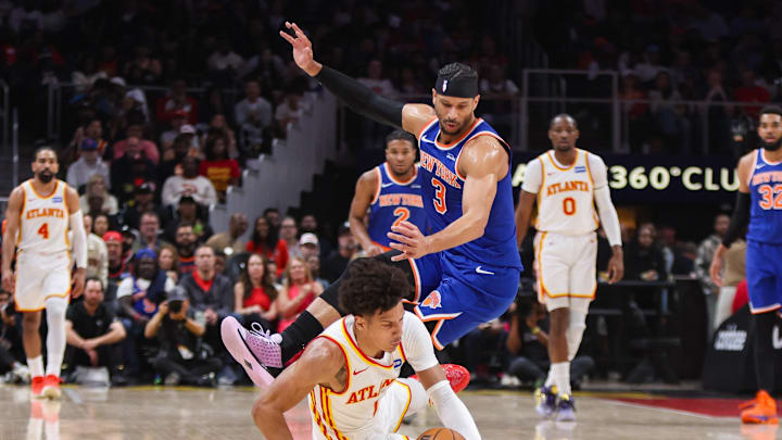 Apr 30, 2026; Atlanta, Georgia, USA; Atlanta Hawks forward Jalen Johnson (1) and New York Knicks guard Josh Hart (3) dives for a loose ball in the first quarter during game six of the first round of the 2026 NBA Playoffs at State Farm Arena. Mandatory Credit: Brett Davis-Imagn Images
