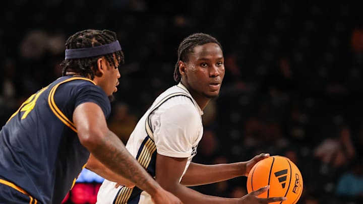 Mar 4, 2026; Atlanta, Georgia, USA; Georgia Tech Yellow Jackets forward Baye Ndongo (11) looks for a pass against California Golden Bears forward Lee Dort (34) during the second half at McCamish Pavilion. Mandatory Credit: Jordan Godfree-Imagn Images