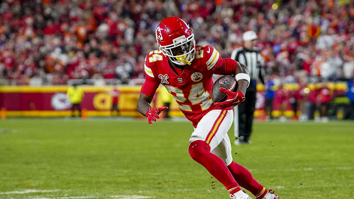 Dec 25, 2025; Kansas City, Missouri, USA; Kansas City Chiefs running back Brashard Smith (24) scores a touchdown attempts to tackle at GEHA Field at Arrowhead Stadium. Mandatory Credit: Denny Medley-Imagn Images