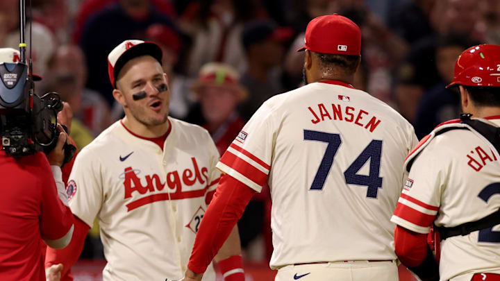 Jun 6, 2025; Anaheim, California, USA; Los Angeles Angels outfielder Mike Trout (27) and pitcher Kenley Jansen (74) celebrate after a win against the Seattle Mariners at Angel Stadium. Mandatory Credit: Jason Parkhurst-Imagn Images