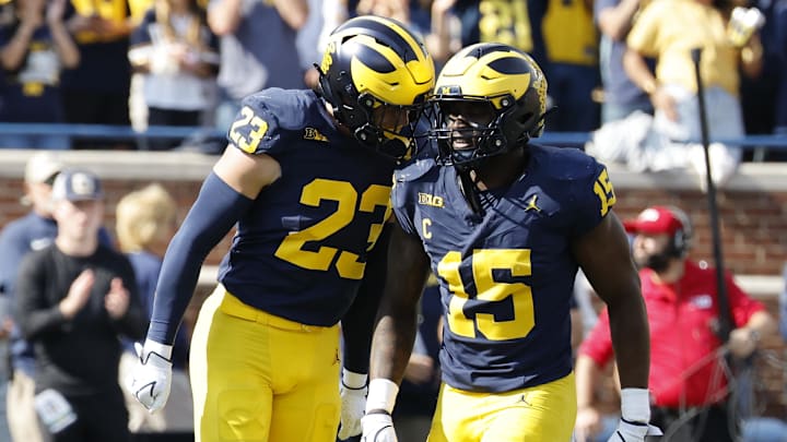 Oct 18, 2025; Ann Arbor, Michigan, USA; Michigan Wolverines linebacker Cole Sullivan (23) and linebacker Ernest Hausmann (15) celebrates in the first half against the Washington Huskies at Michigan Stadium. Mandatory Credit: Rick Osentoski-Imagn Images Oct 18, 2025; Ann Arbor, Michigan, USA; Michigan Wolverines linebacker Cole Sullivan (23) and linebacker Ernest Hausmann (15) celebrates in the first half against the Washington Huskies at Michigan Stadium. Mandatory Credit: Rick Osentoski-Imagn Images
