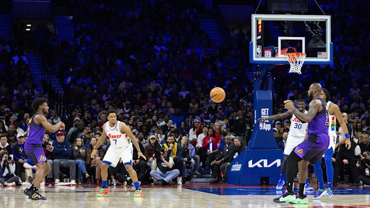 Jan 28, 2025; Philadelphia, Pennsylvania, USA; Los Angeles Lakers guard Bronny James (9) passes the ball to forward LeBron James (23) during the third quarter against the Philadelphia 76ers at Wells Fargo Center. Mandatory Credit: Bill Streicher-Imagn Images